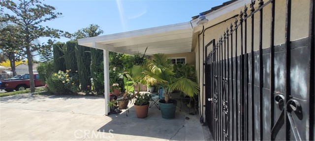 Front Porch - wrought Iron fence leading to back yard.