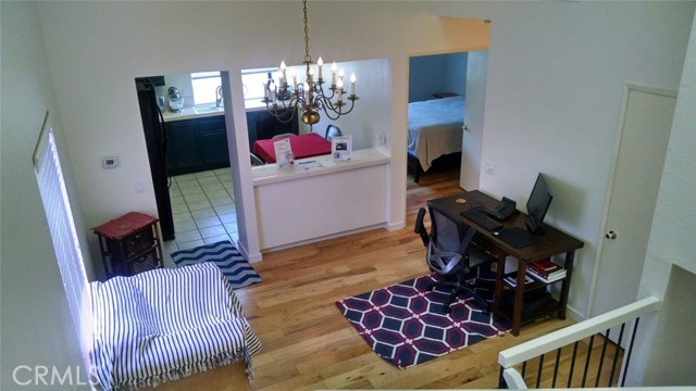 Dining room being used as office area as viewed from the private landing to the upstairs Master.