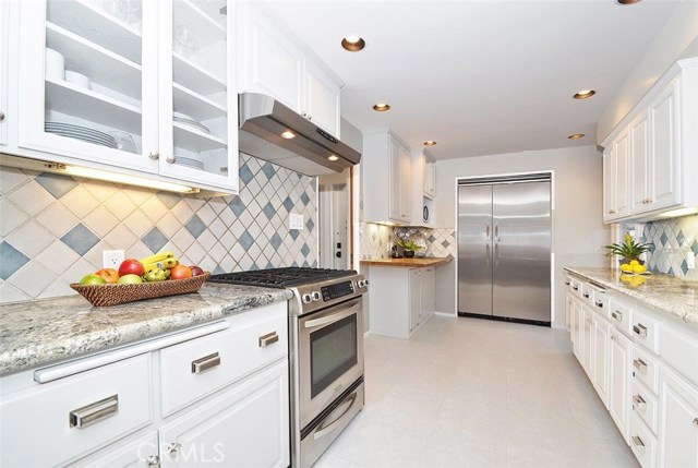 Beautiful kitchen with newly painted cabinets and granite countertops.
