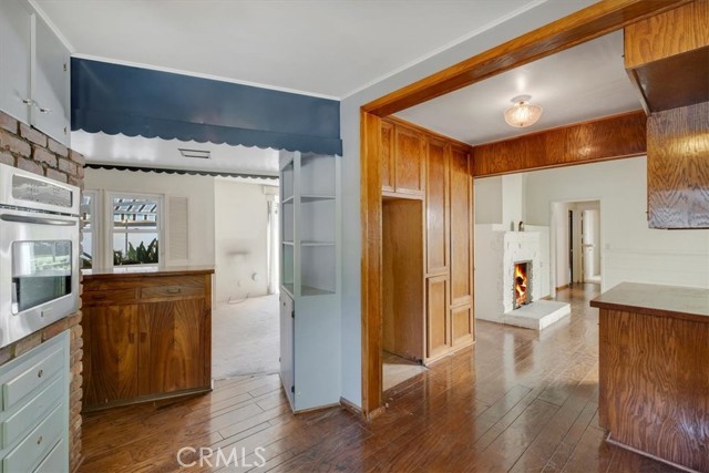 View from kitchen into living room & family room w 2nd fire place