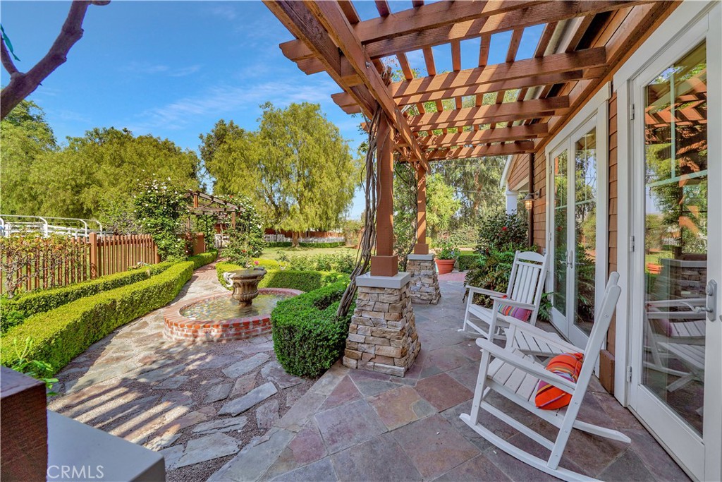 small side patio overlooking the custom fountain
