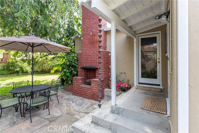 Head outside to your private retreat with lush foliage and flagstone sitting area complete with an outdoor fireplace!