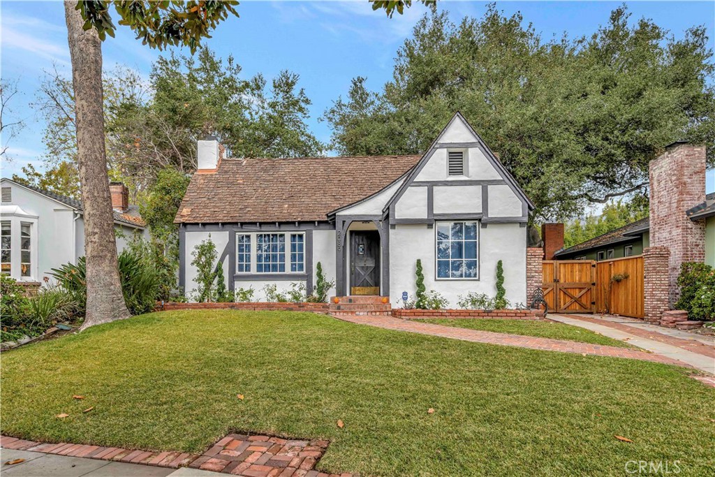 A magical place awaits. Welcome to the Storybook Tudor architecture of 2089 E. Mountain Street. Built in 1929 and one of the four original homes on the block, this delightful home has only had three owners in its 90-year lifespan. The first time on the market in over 50 years, the original front door with original hardware opens into the warm and inviting living room with original brick fireplace with the original adjacent wood box. The red oak hardwood floors are also original throughout the house, as are the plaster walls with the gorgeous and original “Spanish Lace” finish. The dining room is bright and light and take special note of the original double-doors leading into a newly remodeled kitchen with newer Viking stove and Subzero refrigerator. New quartzite counters and subway tile make for period appropriate yet modern features that include an eat-in bar. Brand new single basin stainless steel sink, newly painted cabinets with new hardware finish the look. Enjoy three nice-sized bedrooms, all with original glass windows and cedar closets. Both bathrooms have been completely remodeled with quartz counters, reglazed original tub and reglazed shower, and stunning slate floors. Relax in the large and open sunroom overlooking the charming, private, and peaceful backyard. Plenty of off-street parking or small boat/RV behind gates. This is a one-of-a-kind home, a rare find in Pasadena, updated and ready for a new family to love it and call it home.