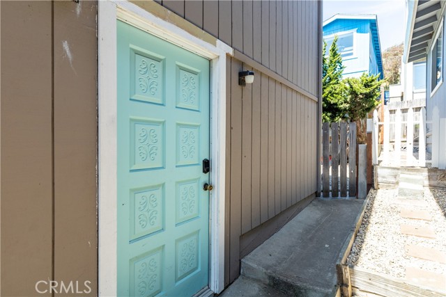 Downstairs unit entrance on side of home.