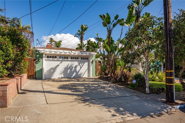 Private entry surrounded by mature tropical landscaping