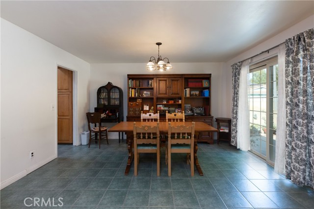 The dining area has a large slider that has direct access to the back yard.