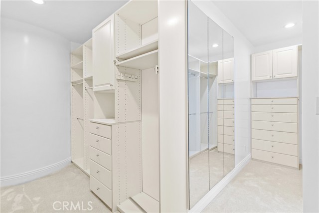 Primary bedroom walk in closet.