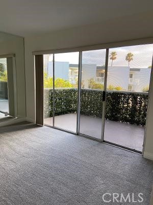 LIVING ROOM OPENING TO PATIO