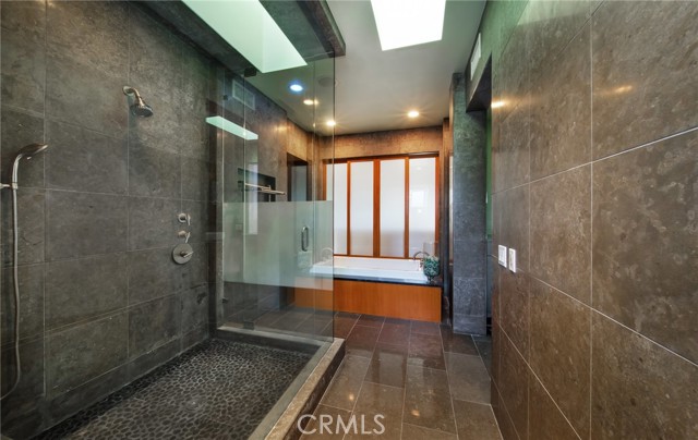 Steam shower and jetted soaking tub in the oversized Master bath area.