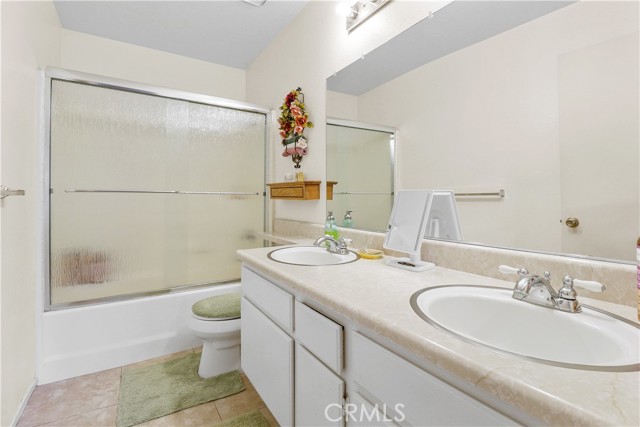 Main bathroom with double sinks.