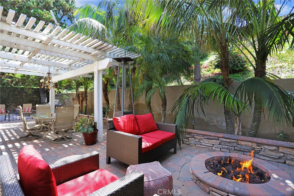 Step into PARADISE!! NEED AN ESCAPE FROM WORK? THIS IS THE HOME FOR YOU WITH THIS TROPICAL PRIVATE WRAP AROUND YARD. ENJOY THE COOL BREEZE RELAXING BY YOUR FIRE PIT. No one behind you or to the left. MUST SEE Stunning 3 Bedroom Home Peacefully Situated In A Quiet Cul-de-sac Street in the Deerfield Community. This Lovely Home Features Functional Open Floor Plan with Remodeled Kitchen with an Island that has lights in the drawers. Formal Living Room Filled with Ample Natural Light from Large Windows and High Ceilings. Luxurious tile floor on first floor, bamboo stairs and throughout the upstairs.  Dramatic Vaulted Ceilings with a New Mantel over the Cozy Fireplace. Fully Upgraded Kitchen Includes Quarts Countertop, Full Backsplash behind the stove. Has Gorgeous Backyard Views Through Newer Double Pane Windows and Doors.  Fully Remodeled Upstairs Bathrooms with Roll-out Shelves.  Master Suite has A Walk-In Closet & A Remodeled Bathroom with Dual Sinks &  Elegant Shower. Charming Private Low Maintenance Backyard with Lush Greens with Brick Pavers & Built in Fire Pit.  LOW HOA, NO MELLO-ROOS. Incredible Community Amenities Including Hiking/Bike Trails, Many Swimming Pools with a Jr Olympic pool also, Multiple Playgrounds, Lighted Tennis, Volleyball, And Racquetball Courts, Disc Golf Course & Bbq Areas. Minutes to Freeways, Irvine Spectrum Center Market, Shopping & Restaurants.Short Walk to Award Winning Schools. BUYERS ASK ME ABOUT CLOSING COST INCENTIVE!