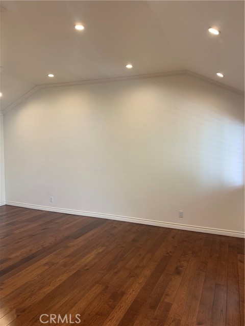 Living room with vaulted ceilings & can lighting