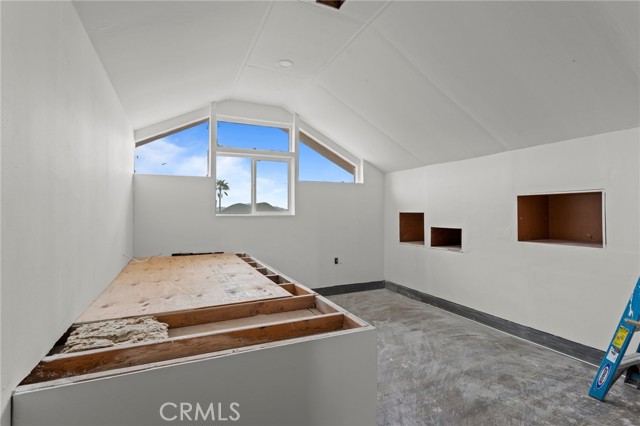Loft on top of house, accessible by exterior staircase
