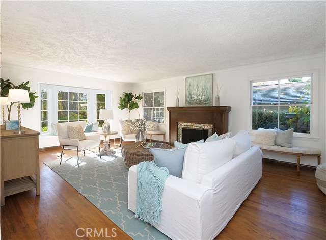 Spacious living room with fireplace and Bay window