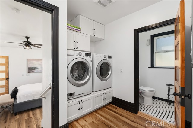 The laundry area has a 1/2 bath. Very convenient for guests. To the left is the entry to the downstairs primary bedroom.