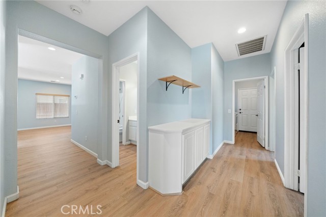 Wide hallway leads the laundry room and 3 car garage!