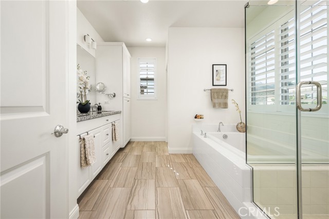 Spa-Inspired Primary Bath with Soaking Tub and Walk-In Shower