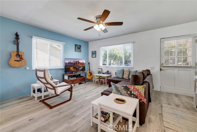 Living Room. Newer dual vinyl windows, ceiling fans, upgraded flooring, cordless blinds