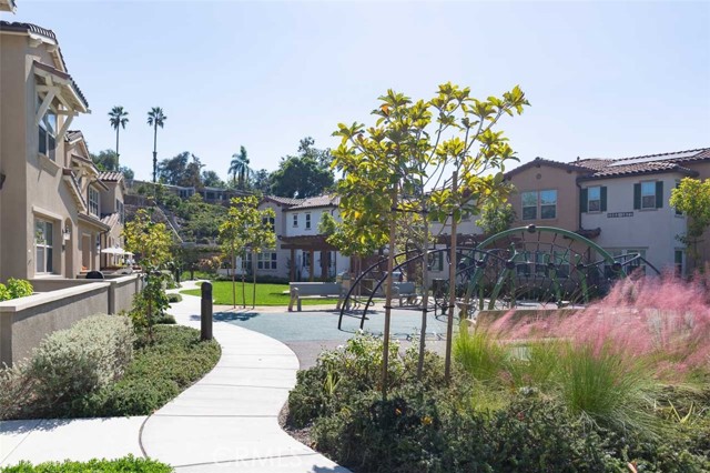 View of community area from street. House visible on left.