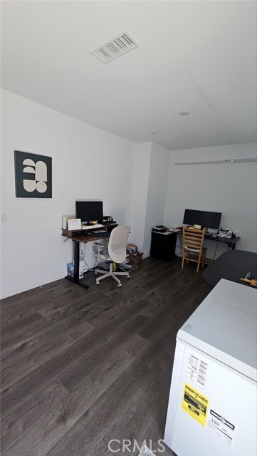 The first-floor den can be used as a third bedroom or home office