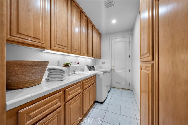 Laundry Room with Sub Zero and laundry chute