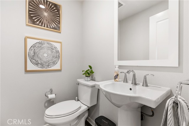 Powder room directly off the spacious second level great room.