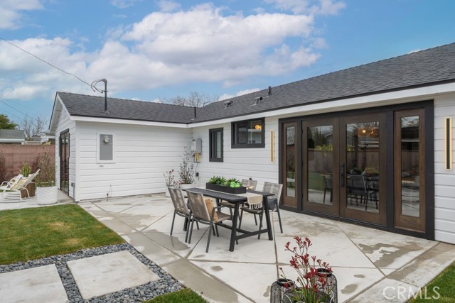 Wood french doors out to patio and backyrd