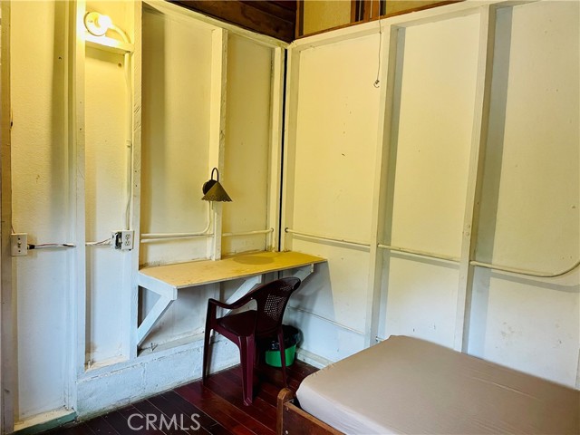Pavones Hotel built-in writing desk and shelves in each room