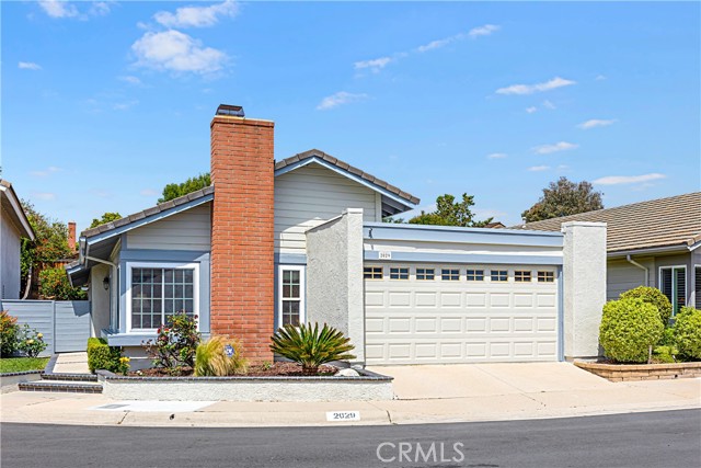 Look no further!! This charming, single-story 3 bedroom, 2 bathroom home located in the desirable "Country Hills" neighborhood and award-winning Brea-Olinda School District, is a MUST-SEE!! Situated on a beautiful tree-lined street in a private cul-de-sac, this home features approximately 1,562 sq. ft of living space and a lot size of 4,725 sq. ft. Step inside to an ample and bright living room with vaulted ceilings and a cozy fireplace. The gourmet, remodeled kitchen features granite counters, recessed lighting, spacious center island, abundant cabinet/counter space and an informal dining area. The kitchen opens up to the family room with vaulted ceilings, which can also be used as an office space for working remotely, and includes french doors leading outside. The spacious master suite, with french doors leading to the quaint brick-lined courtyard, also has an attached remodeled bathroom that includes granite counters, dual sinks and a step-in shower. This home has been impeccably maintained and features wood flooring, dual-paned windows, newer A/C and heating and new interior and exterior paint. Make your way outside to the quaint and private backyard, including a covered patio, grass area and several fruit trees, making it the perfect place for entertaining or just relaxing! The attached two-car garage includes a separate laundry room. Best of all, the low HOA fee includes community pools, spas, tennis and basketball courts, and greenbelts throughout. Abundant guest parking is available nearby. Conveniently located near Birch Hills Golf Course, Brea Mall, dining, parks, schools and transportation, this peaceful and welcoming neighborhood offers a sense of close community that is often hard to find. Don't miss out on the opportunity to make this house your home and experience all that this charming property has to offer. WON'T LAST!!