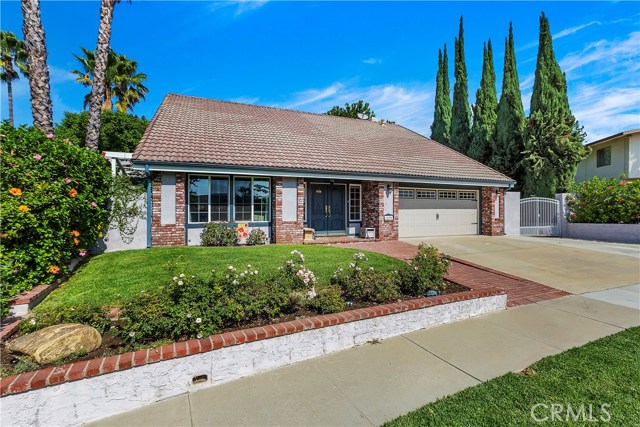 1695 Glenwood Avenue Upland, California Beautiful home with a large backyard ready to welcome a large family. We can start in the kitchen that includes all the amenities a chef would appreciate. Hardwood flooring adorns the staircase, hall, and upstairs bedrooms. The bathrooms have been updated and are simply beautiful. The family room has a coffered ceiling with wood trim and recessed lighting. Home has all dual paned windows, updated interior doors, and hardware. Master bedroom has a fireplace for those cold and cozy nights. The large backyard has a nice covered patio with a ceiling fan and inset lighting illuminates the area. There's also a Splash pool (18" deep) with a lava rock waterfall. Just adjacent to the waterfall is a small area to sit and enjoy that cup of coffee or just relax. The grounds are home to many fruit trees. Last time we checked there were avocados, lemon, pear, nectarine, and yes a plum tree. Lastly, there is room for parking all your toys on the side of the home.