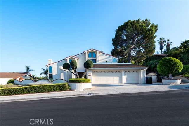 1119 Via Francisca San Pedro, California Overlooking San Pedro’s downtown harbor is a thoughtfully built and charming home set on a quiet cul-de-sac street. From the entrance is the light filled living room with vaulted ceilings, skylight, and complementary brick fireplace. The kitchen is designed with Viking appliances and granite counter tops and is flanked by the dining and family rooms which all lead to the sprawling back yard with gorgeous harbor views. Multiple covered patios and a large deck make this part of the home the optimal place for gatherings. The surrounding landscape offers plenty of room for a full-sized garden or upgrade by adding a pool. Get creative with the covered space adjacent to the back yard by setting up a greenhouse, workshop, or art studio. The upper level is home to two guest bedrooms, a full bath, and the main en-suite with its own balcony for sunset and water views. The extra spacious garage with built-in workshop can be easily converted back to 3 car parking. Find yourself surrounded by water on three sides, with plenty of green space and the freeway within reach. Take advantage of locally owned restaurants, the seaport for a walk along the promenade, catch a quick boat ride to Catalina Island, or visit the many points of interests and fish markets. Create a peaceful lifestyle to enjoy for years.