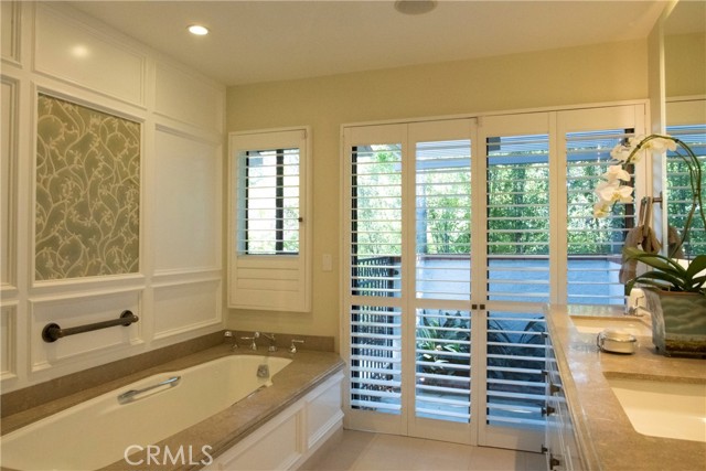 Limestone counters, Custom Mosaic designs and Natural light from Private Patio.