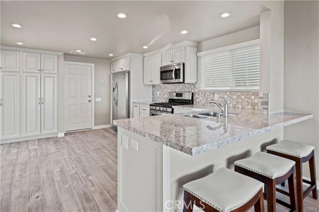 Light & Bright is this dreamy kitchen. Completely upgraded with quartz countertop, stainless appliances and an abundance of cabinets for all your storage needs. The door leads to the 2 car attached garage.
