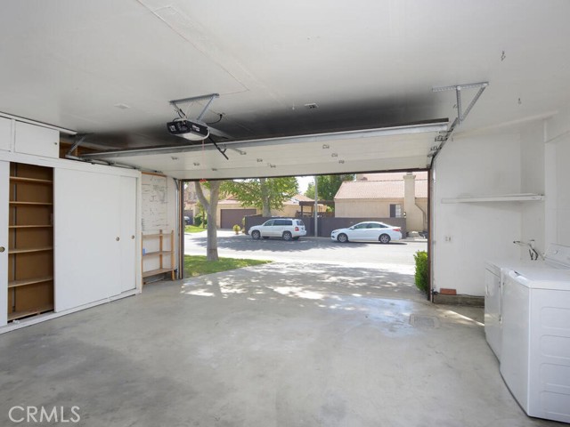 Oversized 2 car garage with abundant sorage cabinets and laundry area (washer and dryer included)