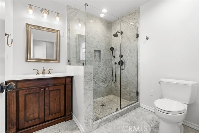 Bathroom #2 is beautifully remodeled with a large walk-in shower.