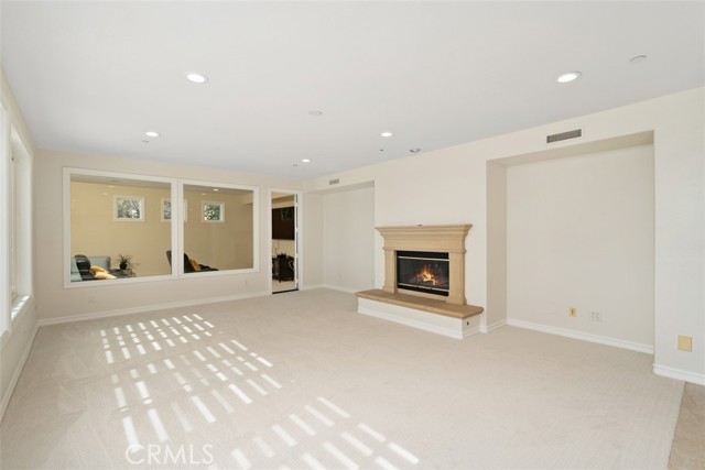 family room with theatre room and open concept kitchen