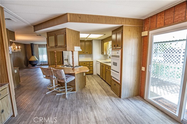 Dual pane sliding glass door leading to open spaces