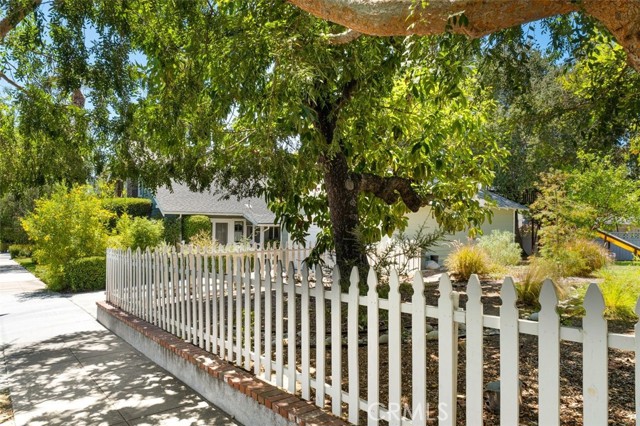 View from Primrose side - yard, driveway and back of house.