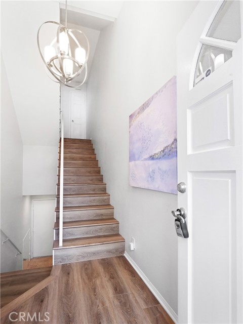 Foyer. Left to Master Suite, Down to Garage, Up to 2nd/3rd Bedrooms