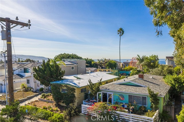 Drone photo of ocean view from approximately 30 feet above the sidewalk in front of the home.