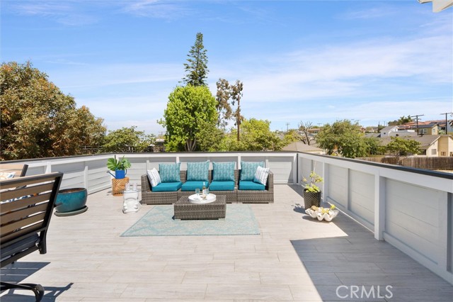 Outdoor living space: Patio (about 400 SF!) on top of the garage, access from the living room of the home
