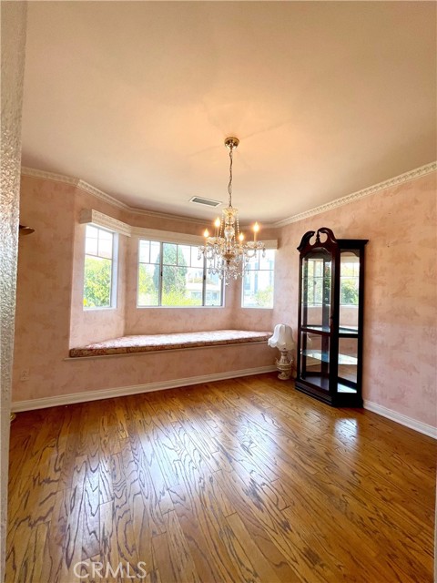 Upscale bay window seat adds to the richness of this room.
