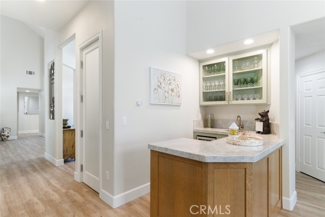 The flow from the kitchen to the walk-in pantry to the wet bar is perfect when you are setting up for a big event or holiday gathering.