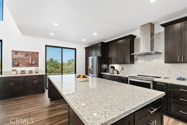 Large quartz center island with all new stainless appliances.