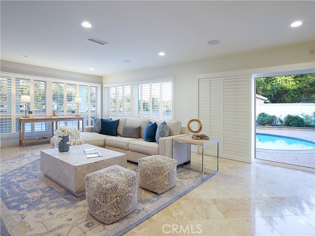 The family room leads directly out to the refreshing swimming pool