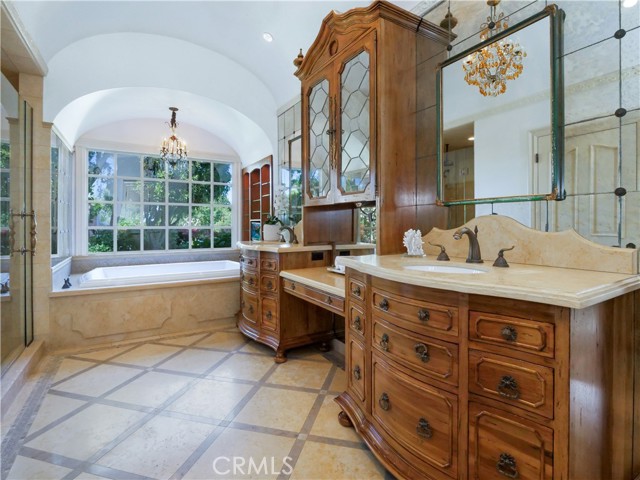 master bathroom with soaking tub, custom vanities