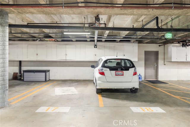 Garage showcasing 2 spaces and 3 storage areas!
