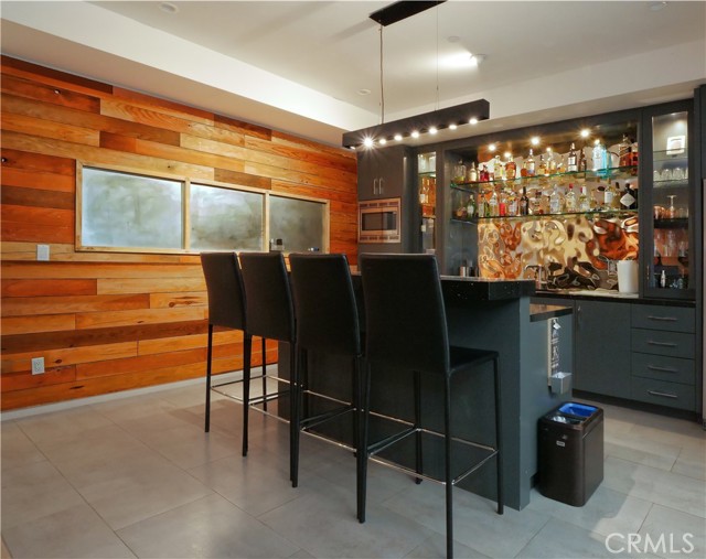 Full bar and kitchenette in basement.