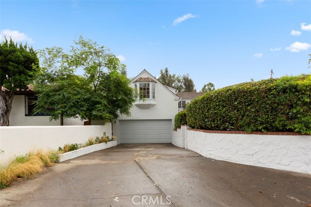 PRIVATE DRIVEWAY WITH LOTS OF SPACE FOR PARKING AND TWO CAR GARAGE