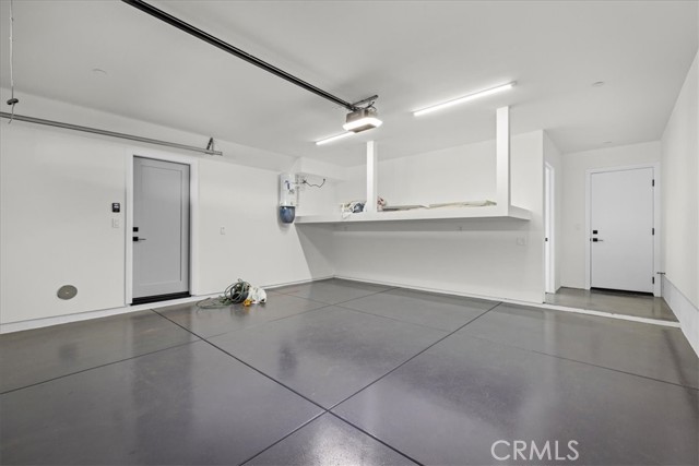 Garage showing entrance to laundry room
